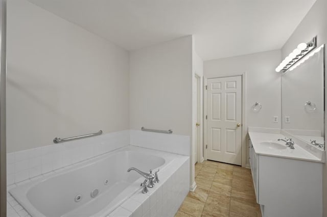 bathroom with vanity and a whirlpool tub