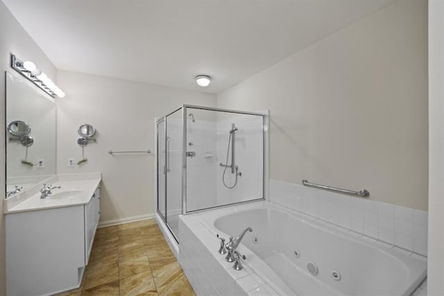 full bath with a jetted tub, baseboards, a shower stall, and vanity