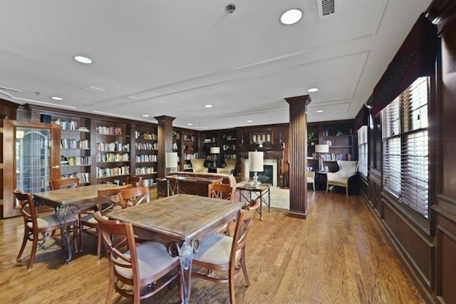 dining room featuring ornate columns, light wood-style flooring, visible vents, and recessed lighting