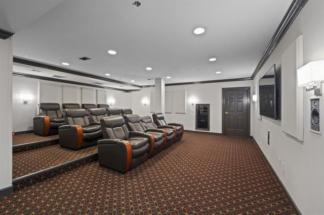 cinema room featuring carpet, ornamental molding, baseboards, and recessed lighting