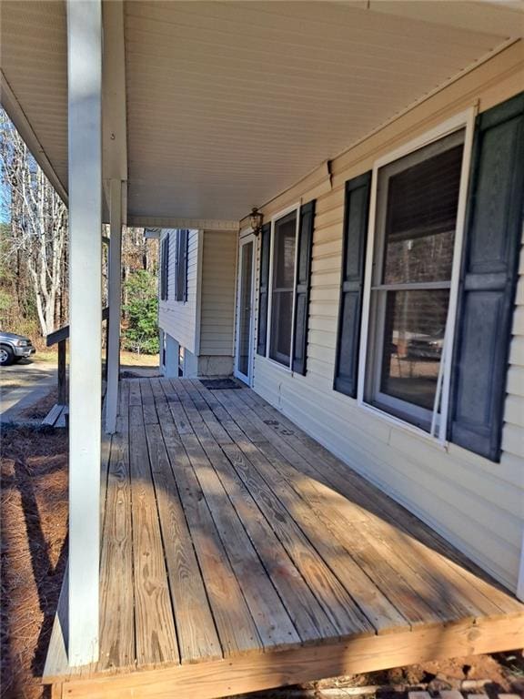 wooden terrace with a porch