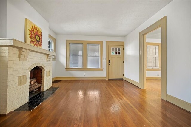 unfurnished room with light wood-style floors, visible vents, and baseboards