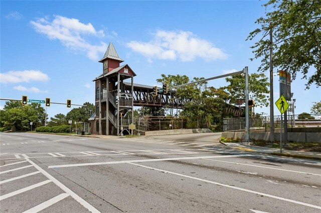 view of side of property with uncovered parking