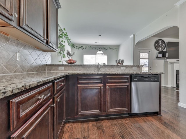 kitchen with dishwasher, decorative backsplash, a healthy amount of sunlight, sink, and light stone counters