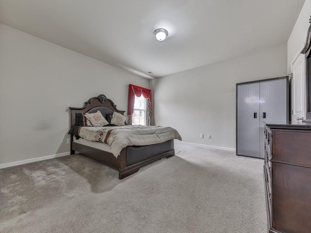 bedroom featuring light colored carpet