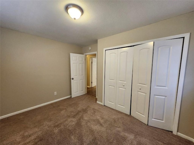 unfurnished bedroom featuring a closet and carpet