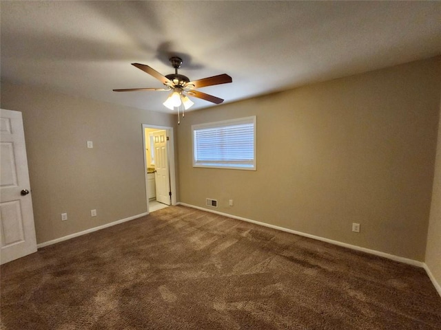 unfurnished bedroom featuring ceiling fan, ensuite bathroom, and carpet floors