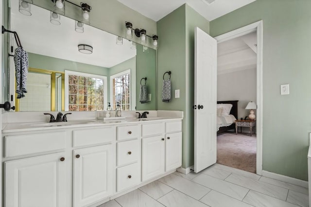 bathroom with ensuite bath, a sink, baseboards, double vanity, and an enclosed shower