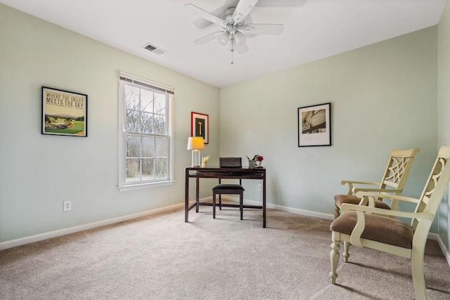 office featuring baseboards, carpet, visible vents, and a ceiling fan