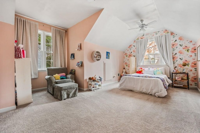 carpeted bedroom featuring lofted ceiling, ceiling fan, and baseboards