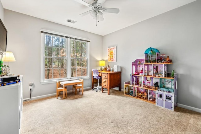 interior space with a ceiling fan, visible vents, and baseboards