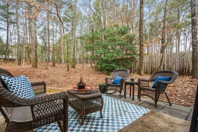 view of patio / terrace featuring fence