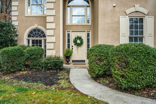 doorway to property with stucco siding