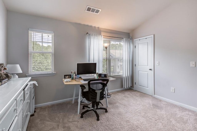 office featuring lofted ceiling and light colored carpet