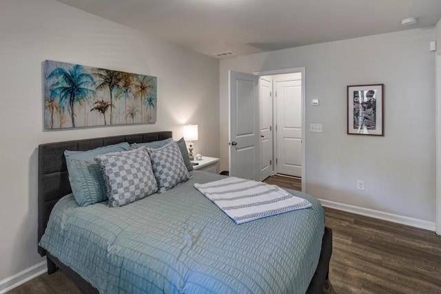 bedroom featuring dark hardwood / wood-style flooring