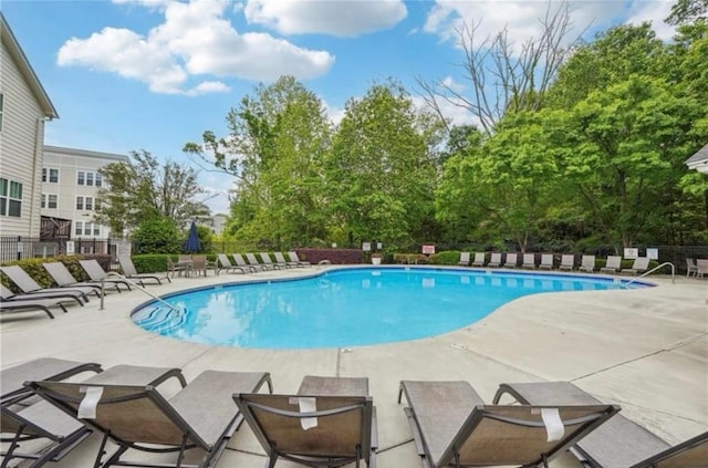 view of swimming pool featuring a patio area