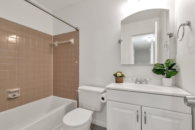 bathroom with toilet, bathing tub / shower combination, and vanity