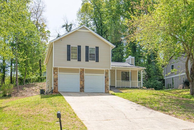 view of front of property with a porch, a chimney, a front yard, a garage, and concrete driveway