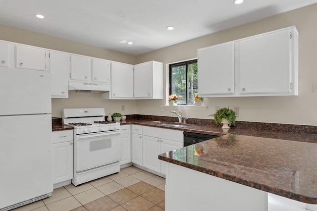 kitchen with white appliances, white cabinets, under cabinet range hood, and a sink