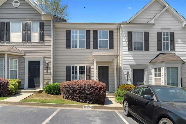 townhome / multi-family property with uncovered parking