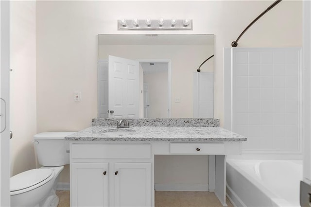 bathroom featuring toilet, vanity, and bathing tub / shower combination