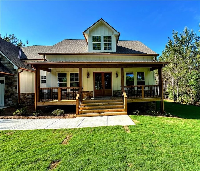 136 Rainey Rd, Temple, GA 30179 - bungalow featuring a porch, a shingled roof, stone siding, a front yard, and board and batten siding