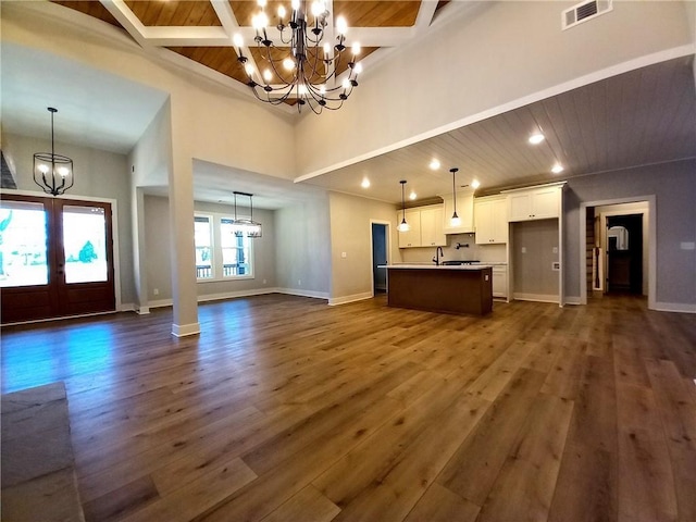 136 Rainey Rd, Temple, GA 30179 - unfurnished living room with a chandelier, dark wood-style flooring, a wood ceiling with exposed beams, and recessed lighting