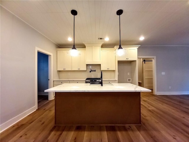 136 Rainey Rd, Temple, GA 30179 - kitchen featuring white cabinets, wood ceiling, light stone counters, dark wood-style flooring, and a center island with sink