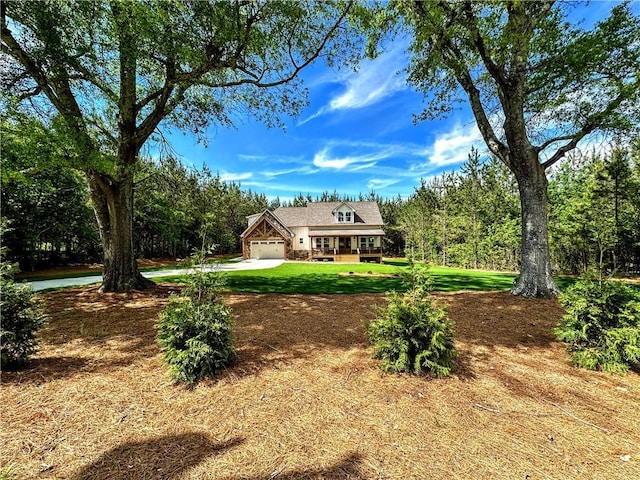 136 Rainey Rd, Temple, GA 30179 - view of front of house featuring a front yard, concrete driveway, and an attached garage