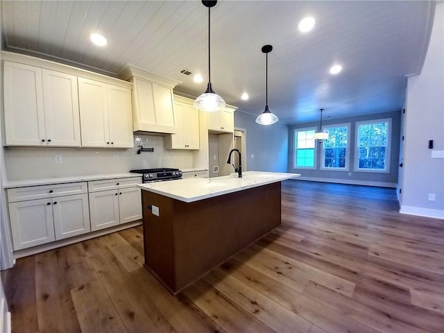 136 Rainey Rd, Temple, GA 30179 - kitchen with dark wood-style floors, recessed lighting, white cabinetry, wood ceiling, and an island with sink