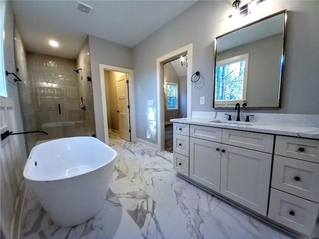 136 Rainey Rd, Temple, GA 30179 - full bath featuring a shower stall, vanity, marble look tiles, and a freestanding bath