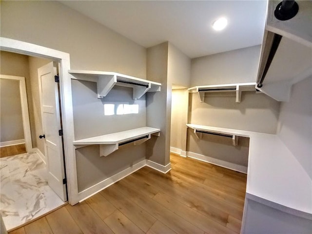 136 Rainey Rd, Temple, GA 30179 - spacious closet featuring wood finished floors