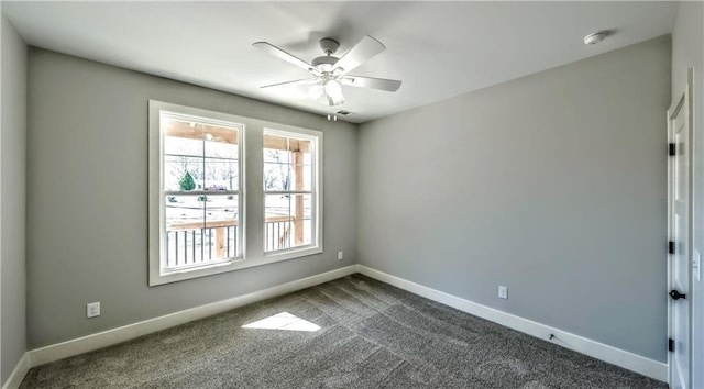 136 Rainey Rd, Temple, GA 30179 - spare room featuring a ceiling fan, dark carpet, and a smoke detector