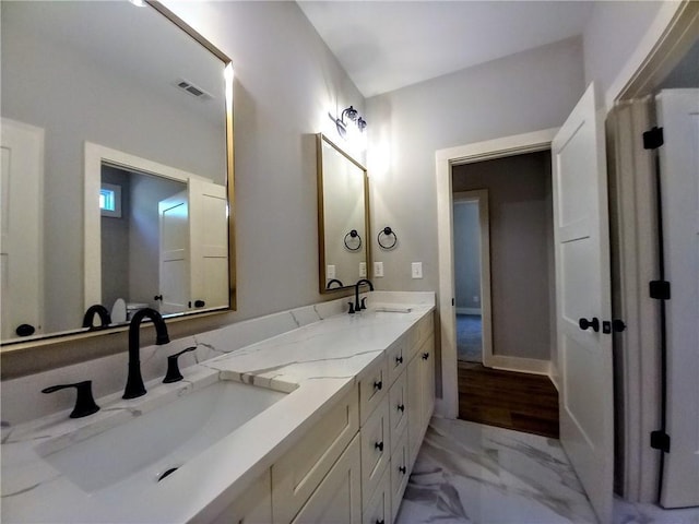 136 Rainey Rd, Temple, GA 30179 - full bathroom featuring double vanity and marble finish flooring