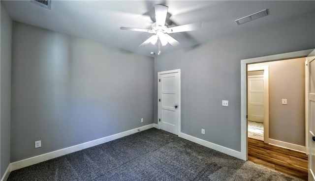 136 Rainey Rd, Temple, GA 30179 - unfurnished bedroom with dark colored carpet and a ceiling fan