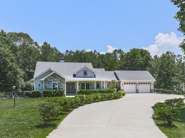 430 Cajun Dr, Ellijay, GA 30540 - view of front of home featuring stone siding, an attached garage, concrete driveway, a front yard, and a chimney