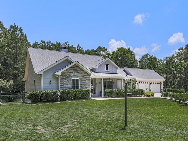 430 Cajun Dr, Ellijay, GA 30540 - view of front facade featuring a garage, a chimney, board and batten siding, roof with shingles, and stone siding