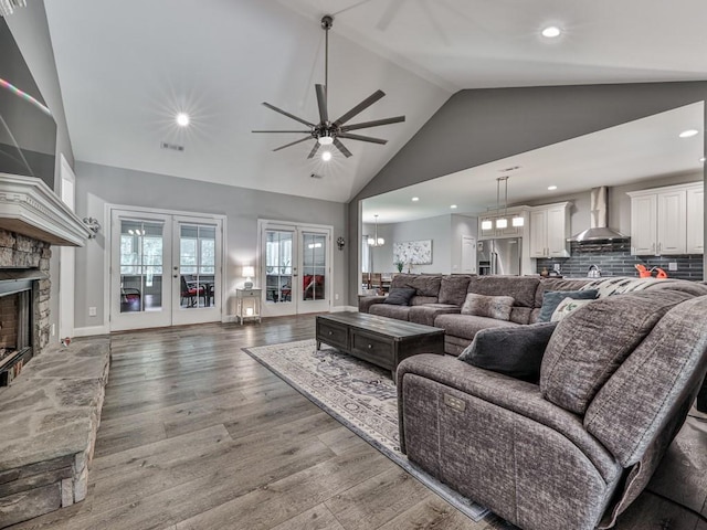 430 Cajun Dr, Ellijay, GA 30540 - living area with a ceiling fan, light wood-style flooring, french doors, a fireplace, and high vaulted ceiling
