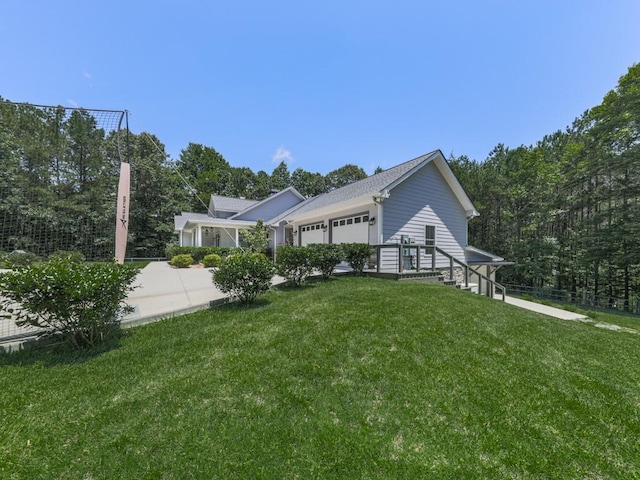 430 Cajun Dr, Ellijay, GA 30540 - view of home's exterior featuring an attached garage and a lawn