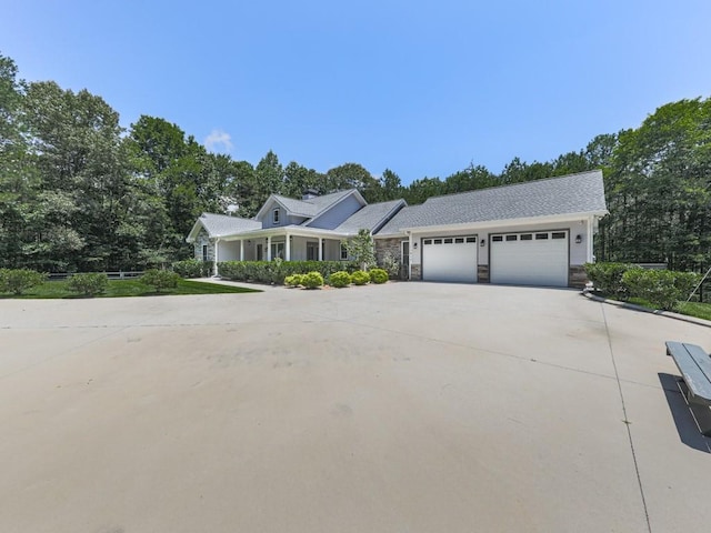 430 Cajun Dr, Ellijay, GA 30540 - view of front facade with an attached garage, driveway, and stone siding