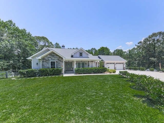 430 Cajun Dr, Ellijay, GA 30540 - view of front of property with an attached garage, driveway, stone siding, a chimney, and a porch