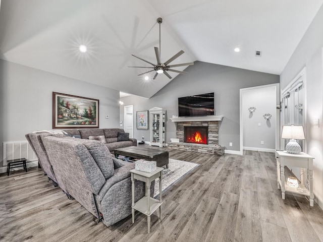 430 Cajun Dr, Ellijay, GA 30540 - living area with wood finished floors, vaulted ceiling, ceiling fan, a stone fireplace, and recessed lighting