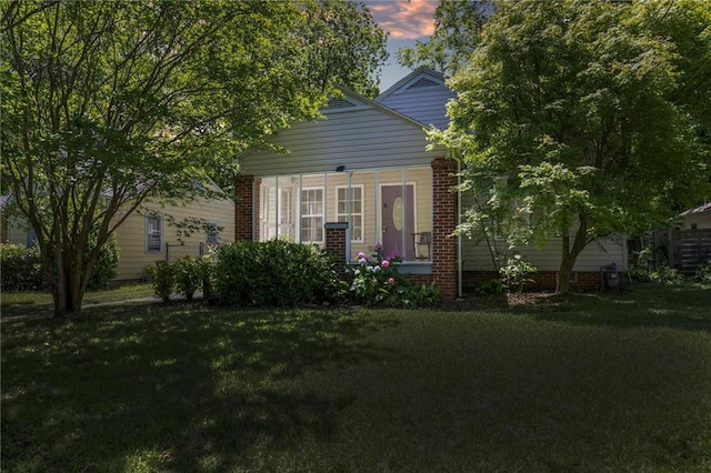 1834 Broad Ave, Atlanta, GA 30344 - view of property hidden behind natural elements with a front lawn and brick siding