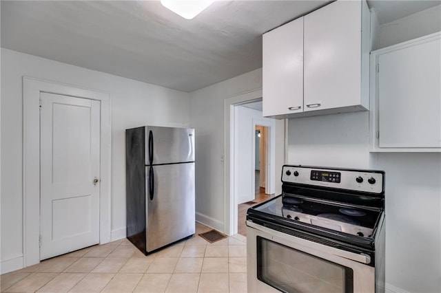 1834 Broad Ave, Atlanta, GA 30344 - kitchen featuring stainless steel appliances, white cabinetry, light tile patterned floors, and baseboards