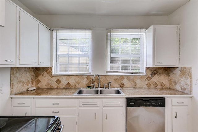 1834 Broad Ave, Atlanta, GA 30344 - kitchen featuring stainless steel dishwasher, a sink, white cabinets, and light countertops