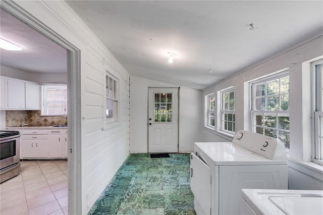 1834 Broad Ave, Atlanta, GA 30344 - laundry area featuring washer / clothes dryer, healthy amount of natural light, and light tile patterned floors
