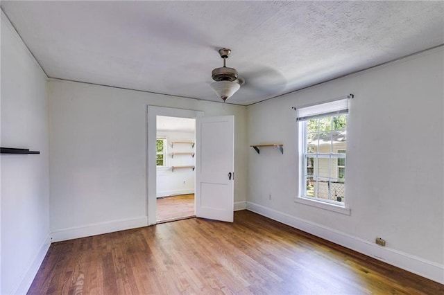 1834 Broad Ave, Atlanta, GA 30344 - empty room featuring wood finished floors, baseboards, and a ceiling fan
