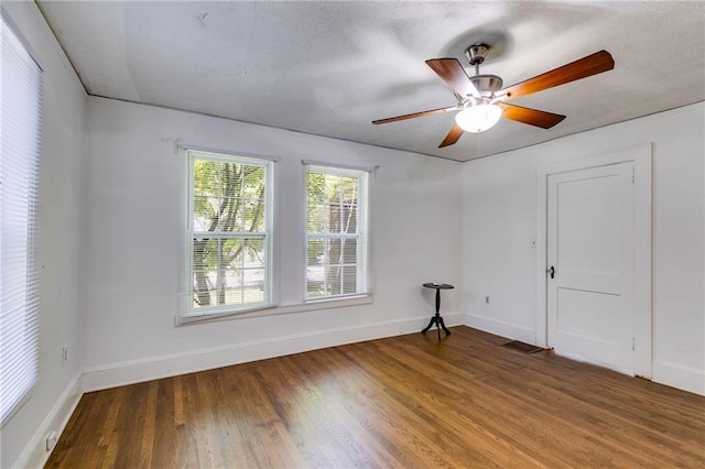 1834 Broad Ave, Atlanta, GA 30344 - empty room featuring wood finished floors, baseboards, and a ceiling fan