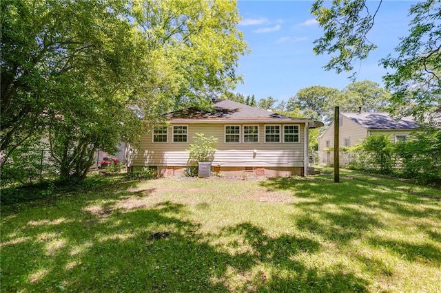 1834 Broad Ave, Atlanta, GA 30344 - rear view of house with a lawn, crawl space, and cooling unit