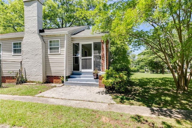 1834 Broad Ave, Atlanta, GA 30344 - doorway to property with a lawn and a chimney